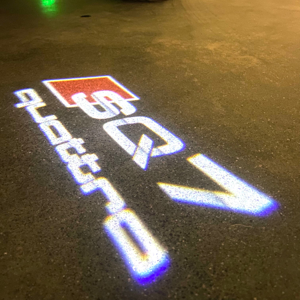 AUDI LOGO PROJECTOT LIGHTS Nr.120 (Menge 1 = 2 Logofolien /2 Türleuchten)