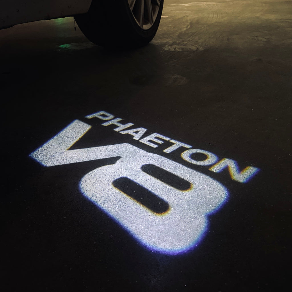 Volkswagen Porta luci PHAETON V8 Logo Nr. 75 (quantità 1 = 2 Logo Film /2 luci)
