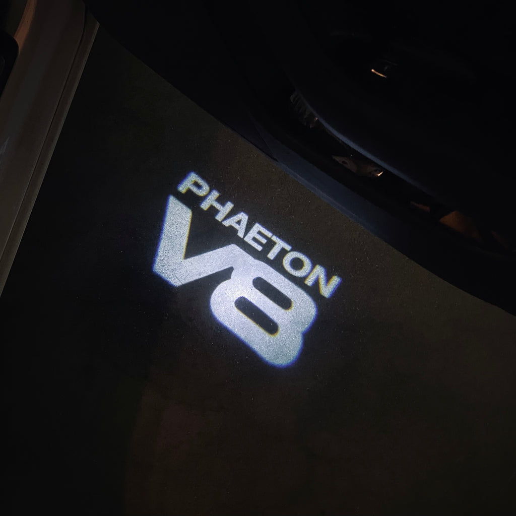 Volkswagen Porta luci PHAETON V8 Logo Nr. 75 (quantità 1 = 2 Logo Film /2 luci)