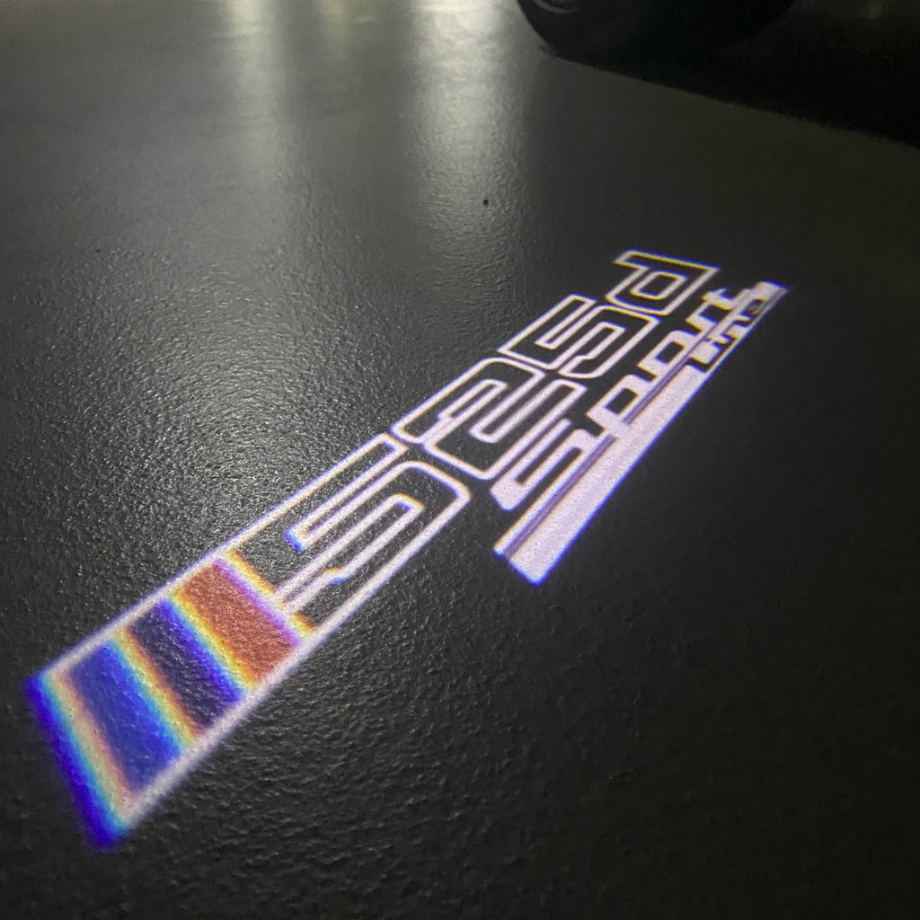 ÉCLAIRAGE DE PROJECTEUR BMW M3 LOGO Nr.24 (quantité 1 = 1 jeux / 2 feux de porte)