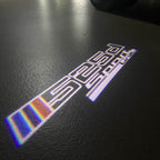 ÉCLAIRAGE DE PROJECTEUR BMW M3 LOGO Nr.24 (quantité 1 = 1 jeux / 2 feux de porte)