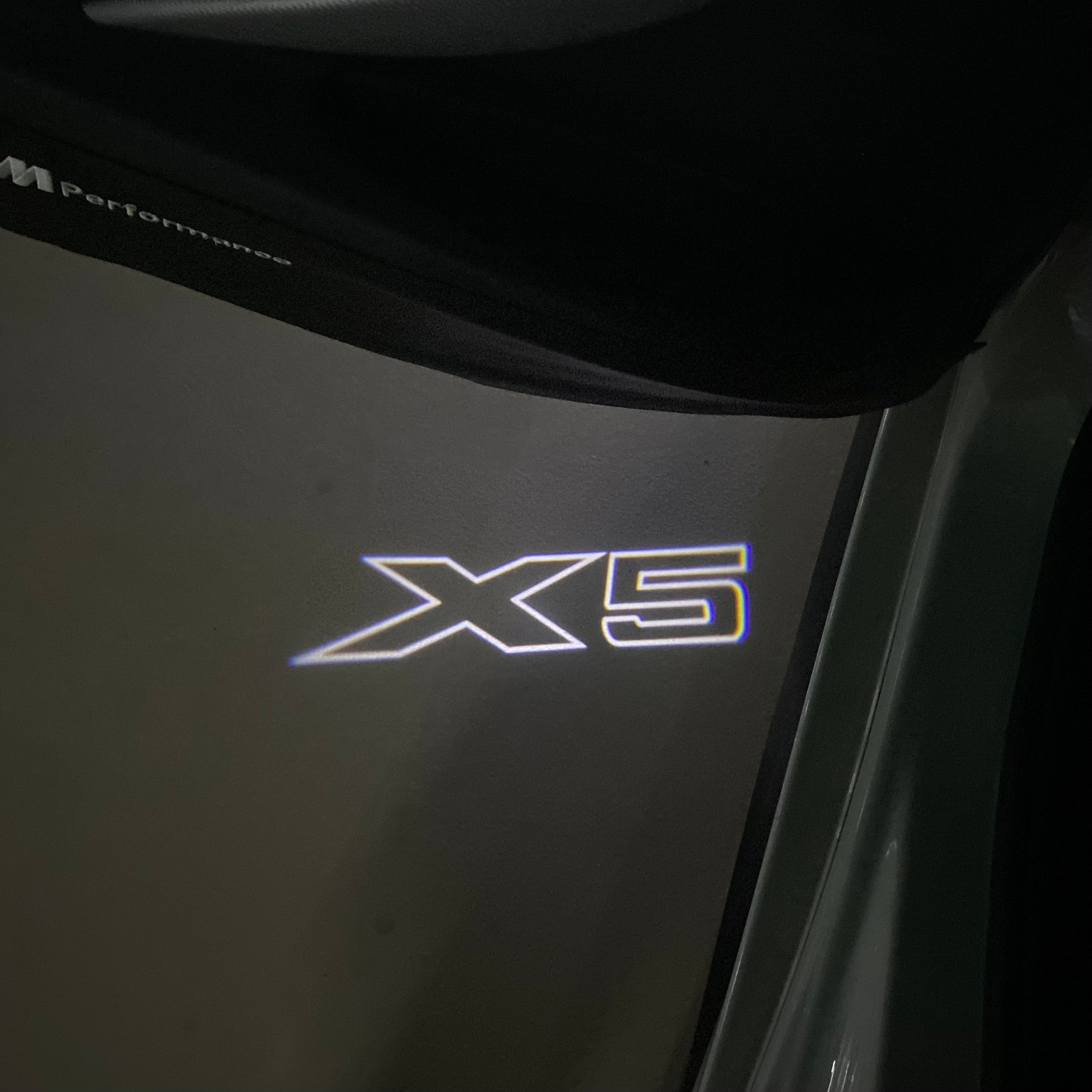 BMW X5    LOGO PROJECTOT LIGHTS (quantity 1 = 1 sets/2 door lights) Nr.6024q0t067