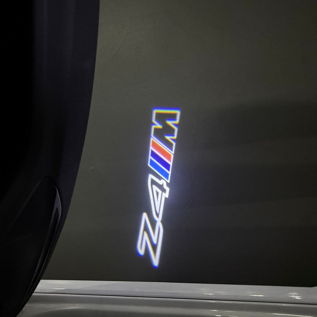 BMW Z4M  LOGO PROJECTOT LIGHTS (quantity 1 = 1 sets/2 door lights) Nr.6024q0t0132