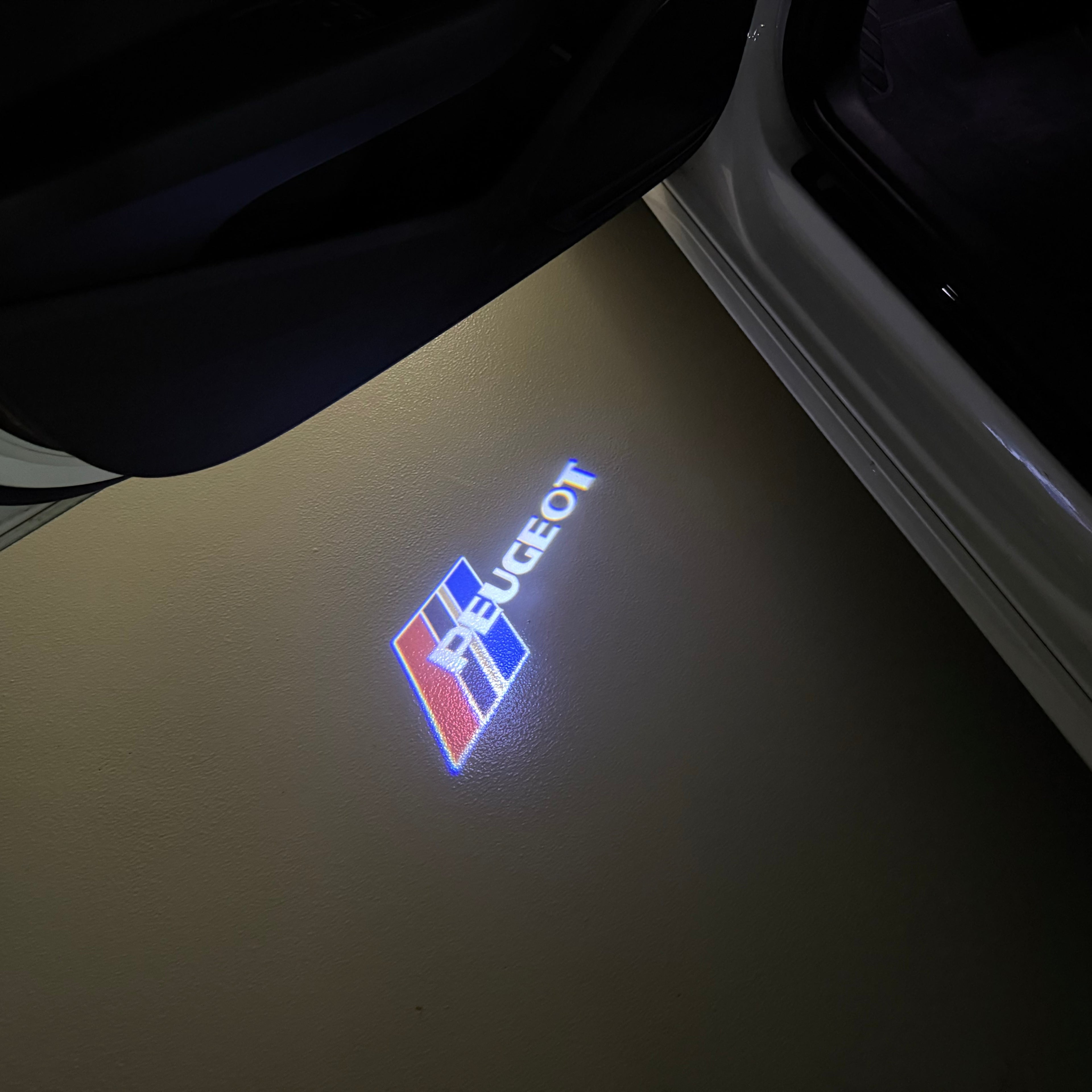PEUGEOT ORIGINAL  LOGO PROJECTOT LIGHTS (quantity 1 = 1 sets/2 door lights) Nr.6024q65