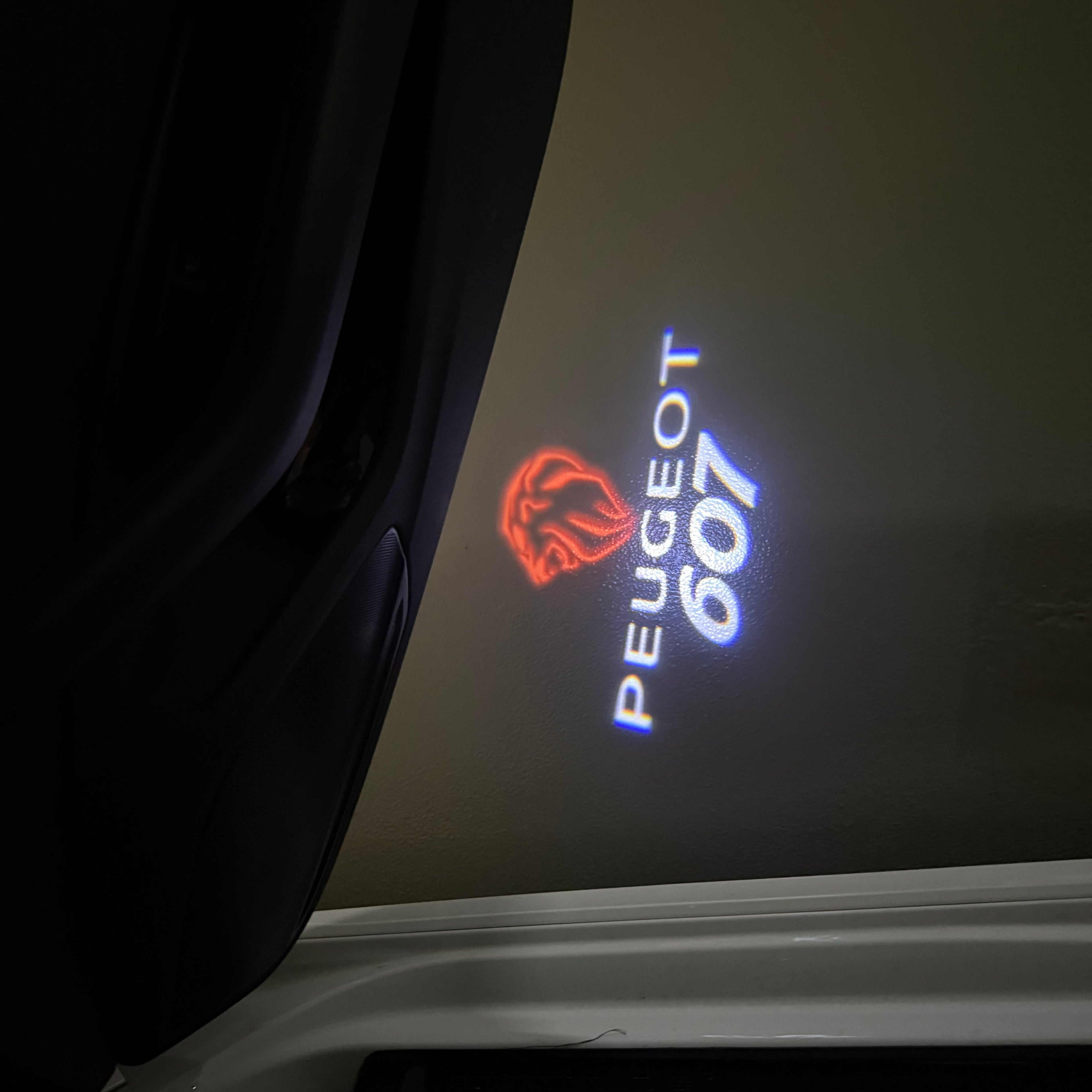PEUGEOT 607  LOGO PROJECTOT LIGHTS (quantity 1 = 1 sets/2 door lights) Nr.6024q52