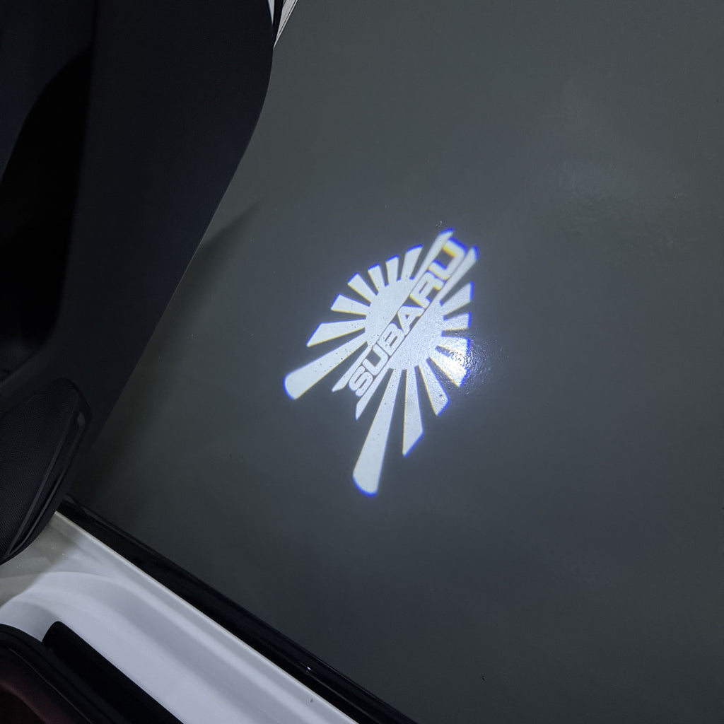 SUBARU ORIGINAL LOGO PROJECROTR LIGHTS (quantity 1 = 1 sets/2 door lights) Nr.10