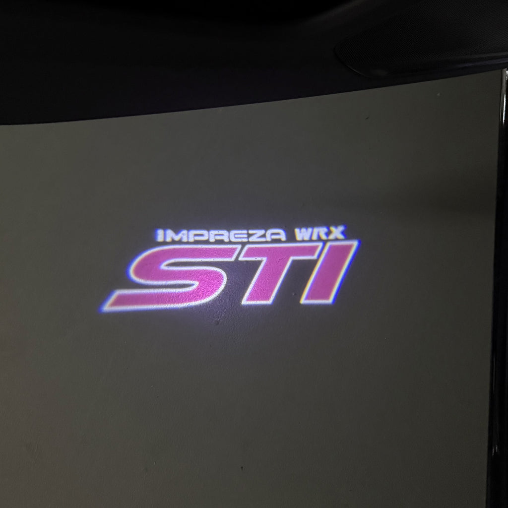 SUBARU IMPREZA STI LOGO PROJECROTR LIGHTS (quantity 1 = 1 sets/2 door lights) Nr.03A23
