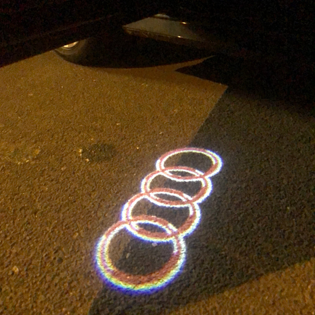 AUDI RING LOGO PROJECTOT LIGHTS Nr.143 (quantité 1 = 2 Logo Films /2 feux de porte)