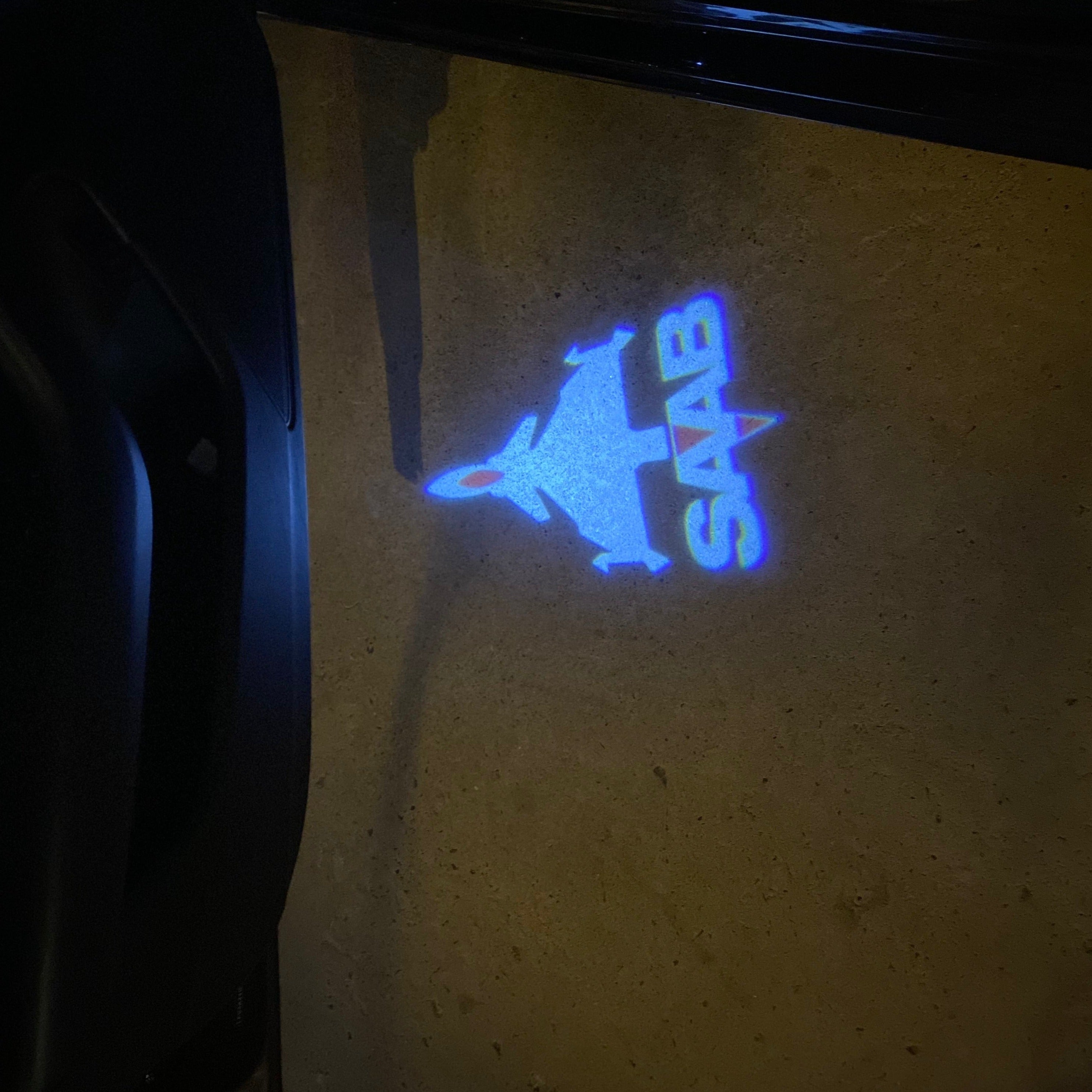 SAAB  Original LOGO PROJECROTR LIGHTS Nr.2506  (quantity 1 = 1 sets/2 door lights)