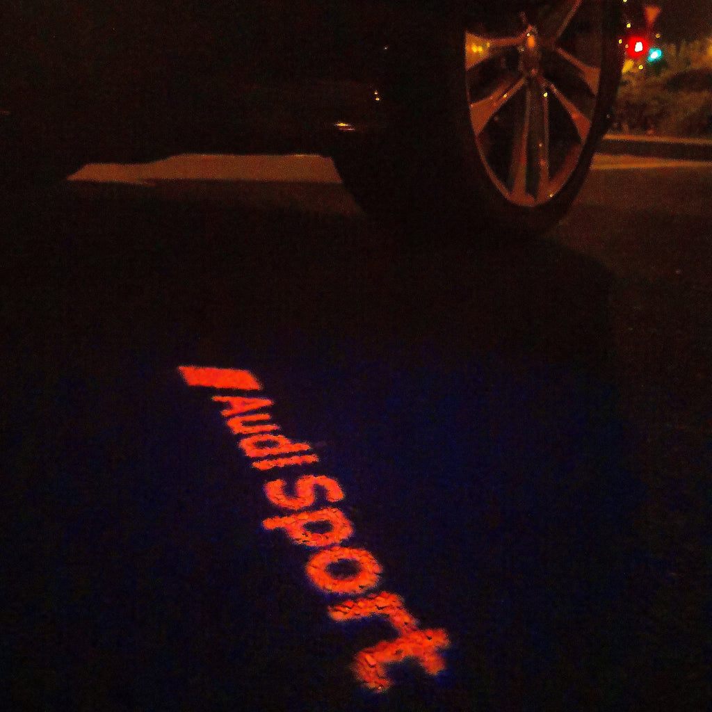 AUDI LOGO PROJECTOT LIGHTS Nr.111 (Menge 1 = 2 Logofolien /2 Türleuchten)