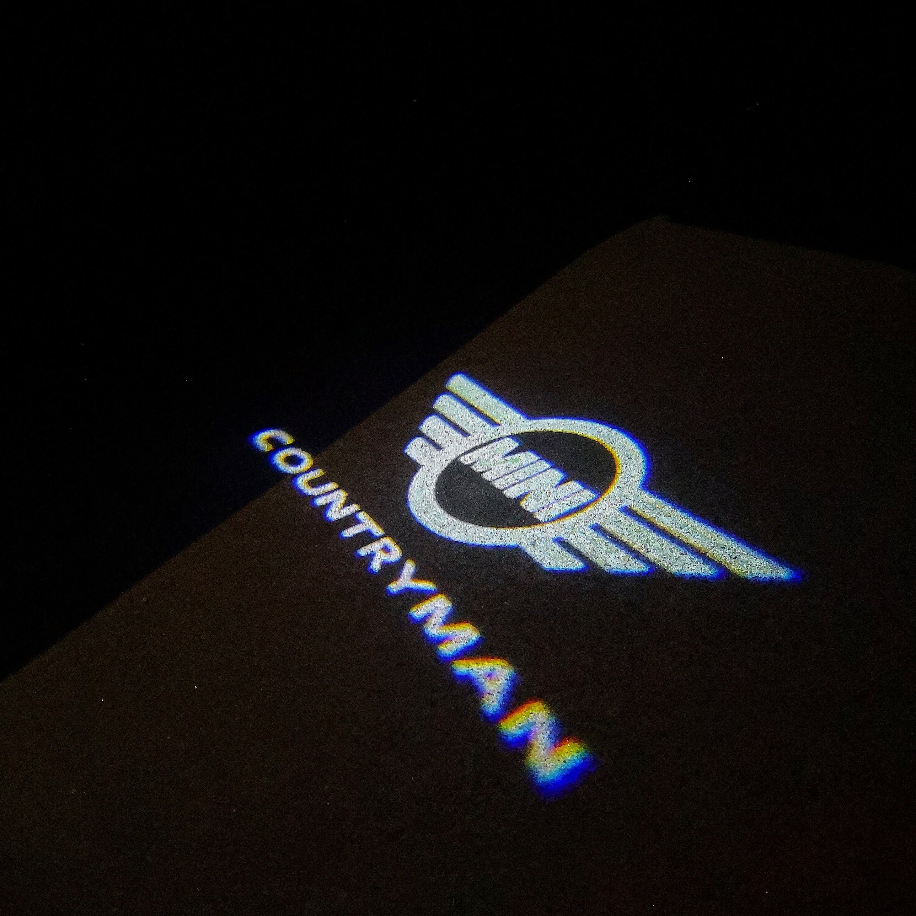 MINI COUNTRYMAN LOGO PROJECROTR LIGHTS Nr.131 (quantità 1 = 2 Logo Film / 2 luci porta)