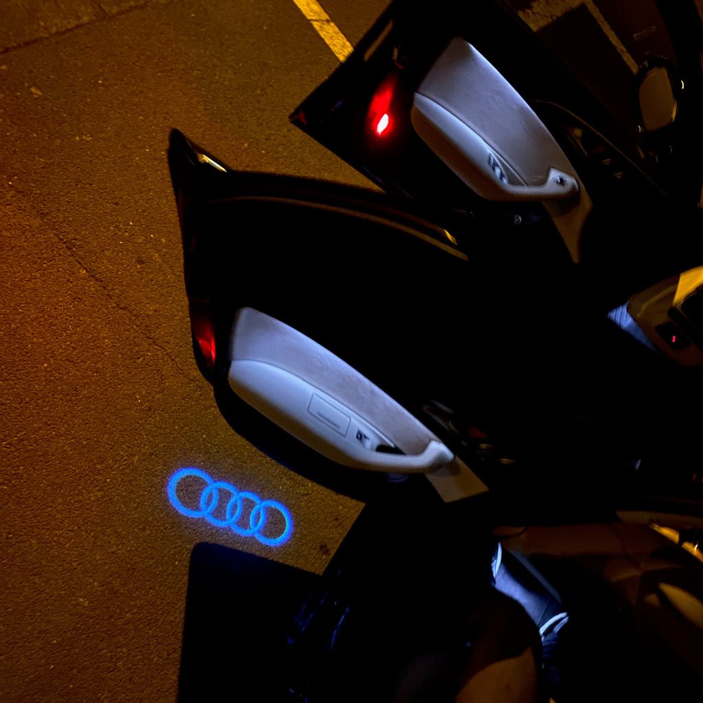 LUCI PROIETTORI LOGO AUDI Nr.08 (quantità 1 = 2 Pellicole Logo / 2 luci porta)