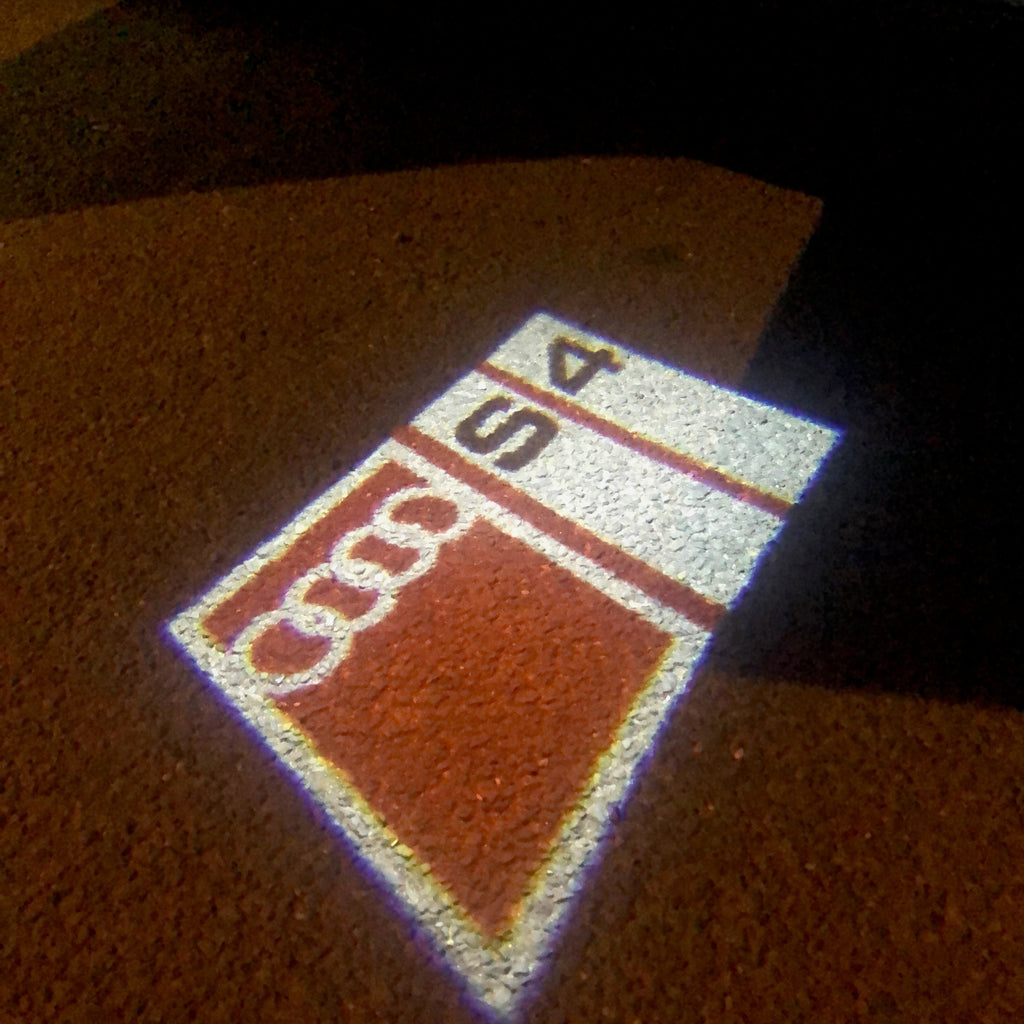 AUDI LOGO PROJECTOT LIGHTS Nr.151 (الكمية 1 = 2 Logo Films /2 أضواء الباب)