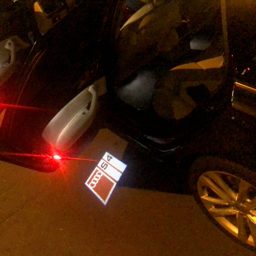 AUDI LOGO PROJECTOT LIGHTS Nr.151 (الكمية 1 = 2 Logo Films /2 أضواء الباب)